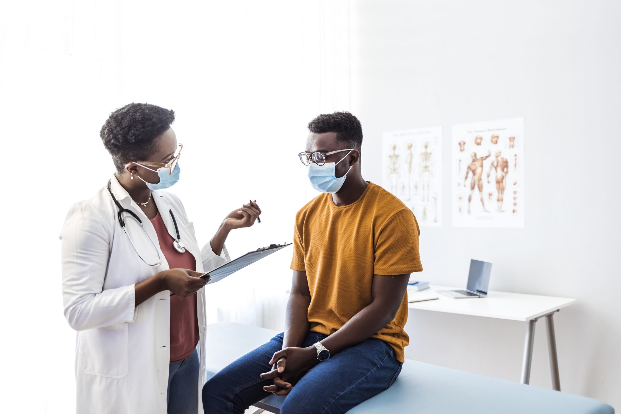 Doctor consulting patient in a medical office.